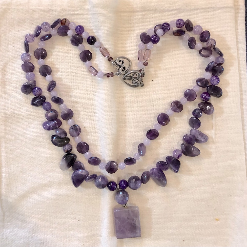 Single strand amethyst, and bead necklace with stone pendant.